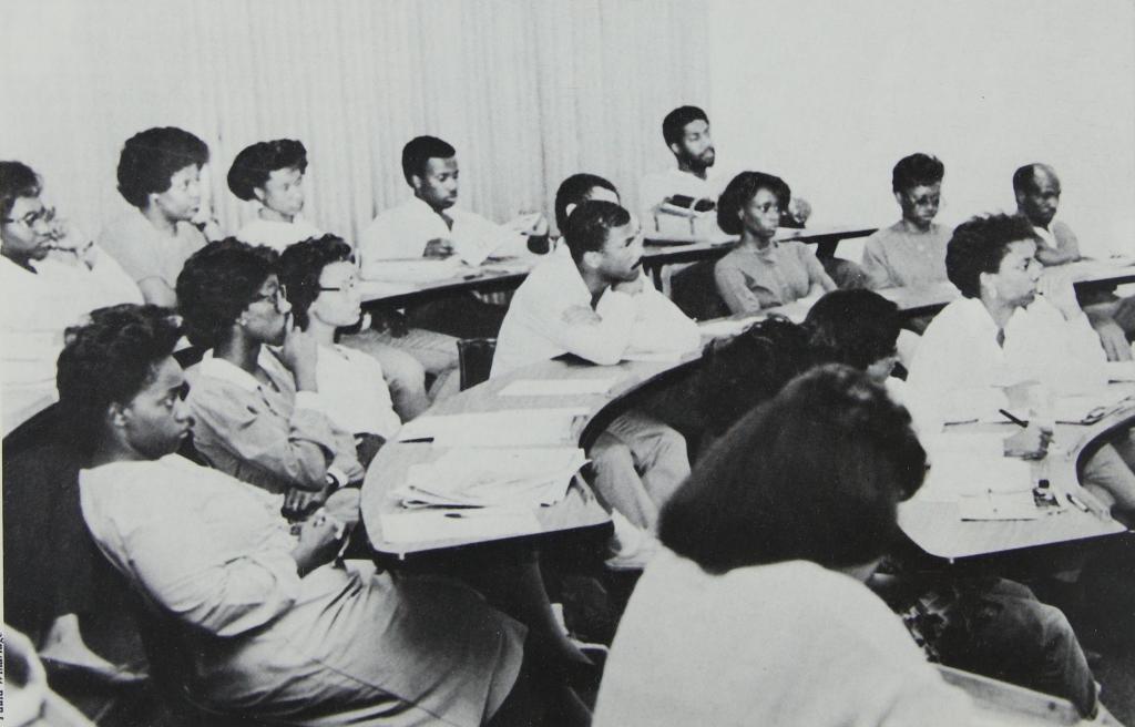 BLSA members gather in a classroom for a meeting, 1987, Barrister (Law School yearbook).