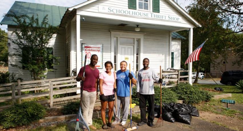 BLSA members and 2014 classmates Andrew Person, Andrea Canfield, Andrew Thebaud and Sean Suber clean up outside the Schoolhouse Thrift Shop in Charlottesville as part of the organization’s community service week in 2012.